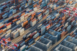 Afternoon aerial view of cargo shipping containers stacked on docks, in Los Angeles, US, 18/08/2016
