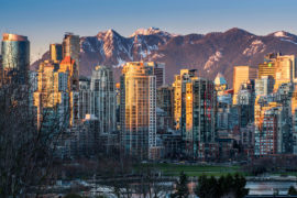 Downtown skyline with snowy mountains behind at sunset, Vancouver, British Columbia, Canada. Credit: Stefano Politi Markovina / Alamy Stock Photo. FBDEJ1