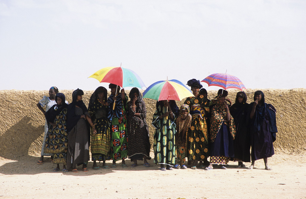 Nomad women sheltering from the sun Near Ingall Niger, West Africa.