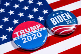 Donald Trump and Joe Biden pin badges, pictured of the USA flag.