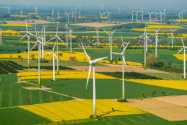 Wind-farm-and-rapeseed-fields-on-the-town-borders-between-Warstein-Belecke-and-Anrochte-Erwitte,-Germany