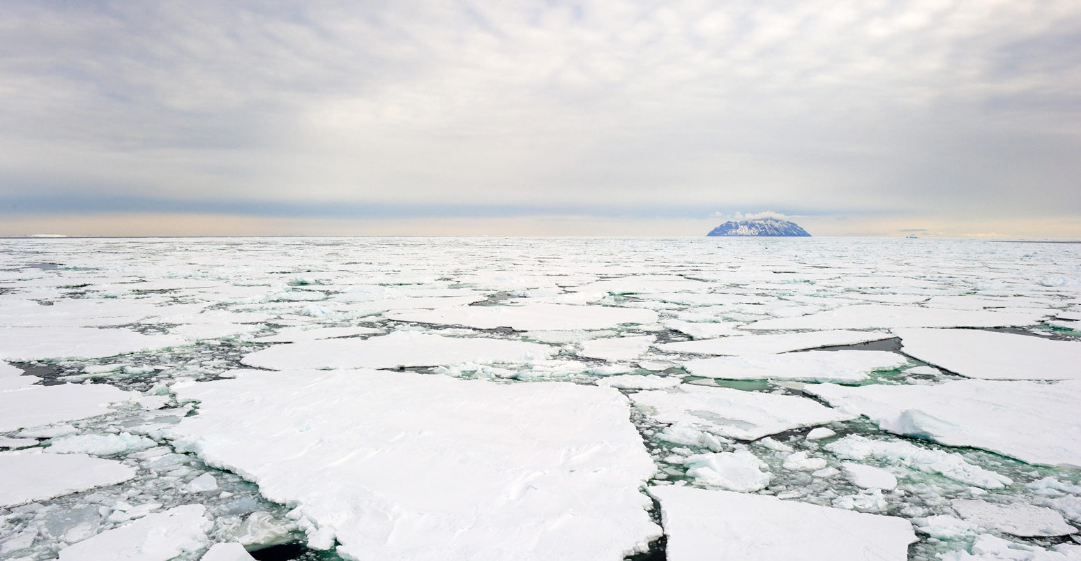 Small island in the Ross Sea, Antarctica, with pack ice in the foreground