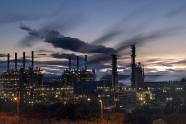 Illuminated natural gas processing plant at night, Scotland