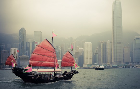 Traditional wooden sailboat sailing in victoria harbour ,Hong Kong.