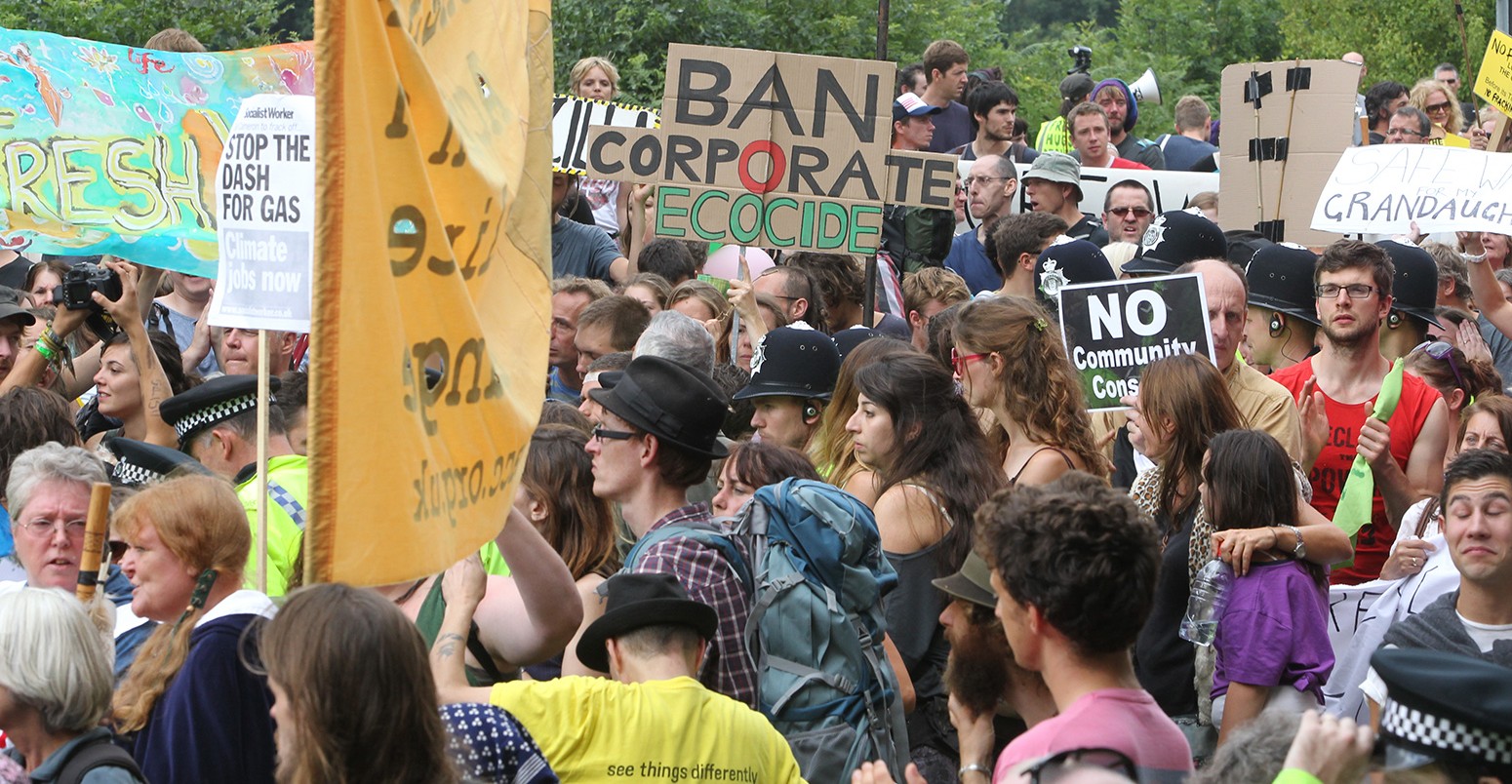 People gather together for an anti-fracking protest march against the energy company Cuadrilla on August 18, 2013 in Balcombe, UK