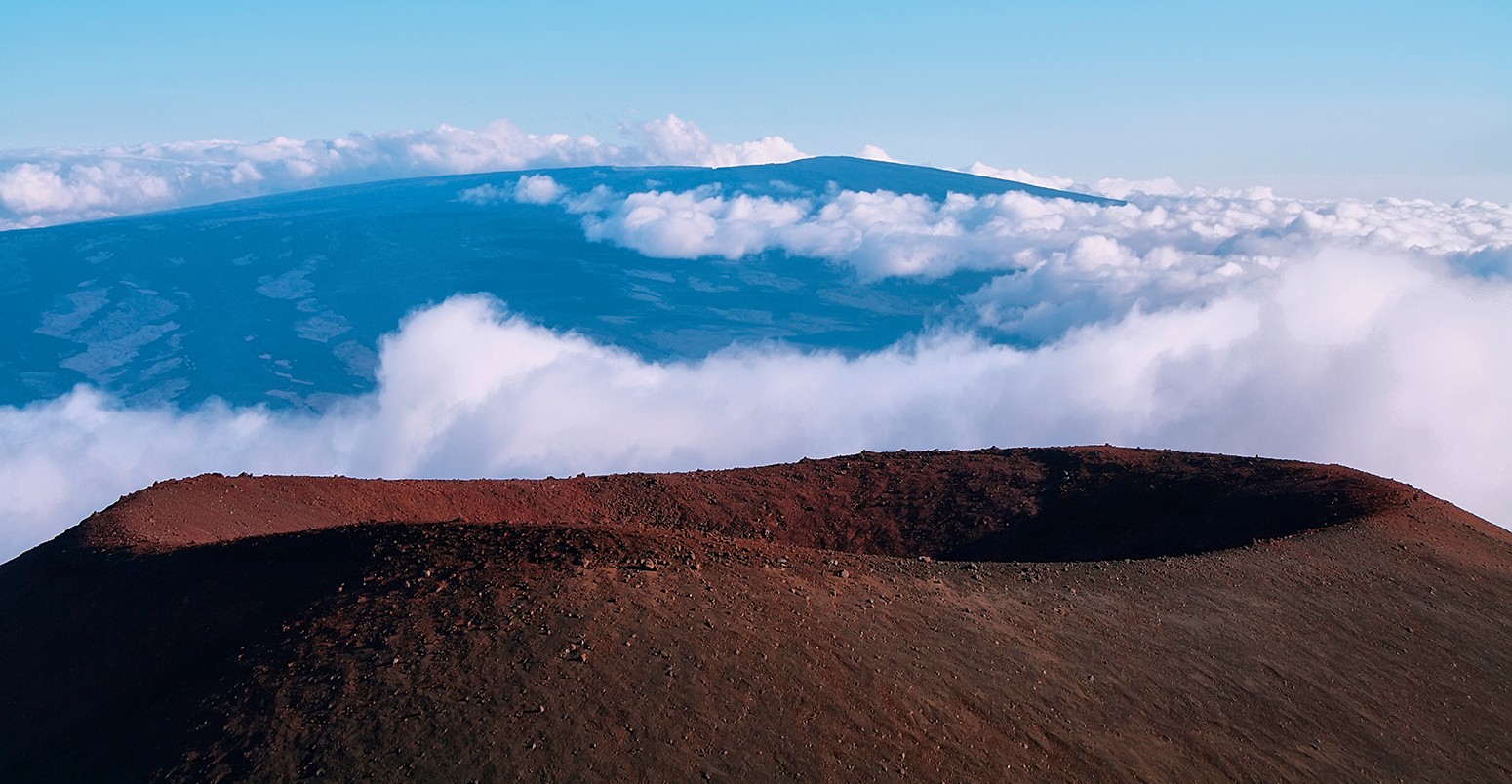 Extinct volcanic crater with Mauna Loa in background from Mauna Kea summit