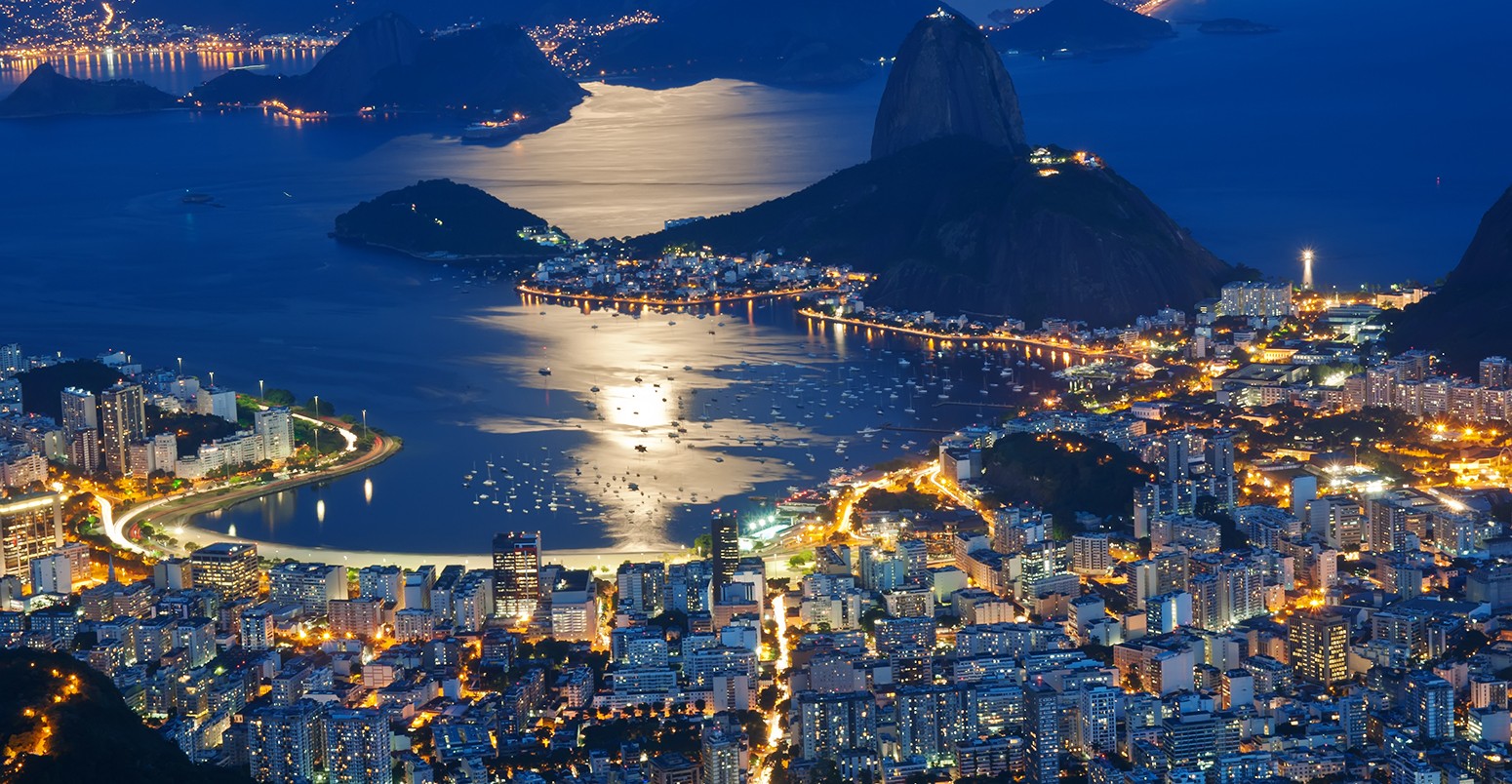 Night view of Sugar Loaf mountain and Botafogo in Rio de Janeiro.