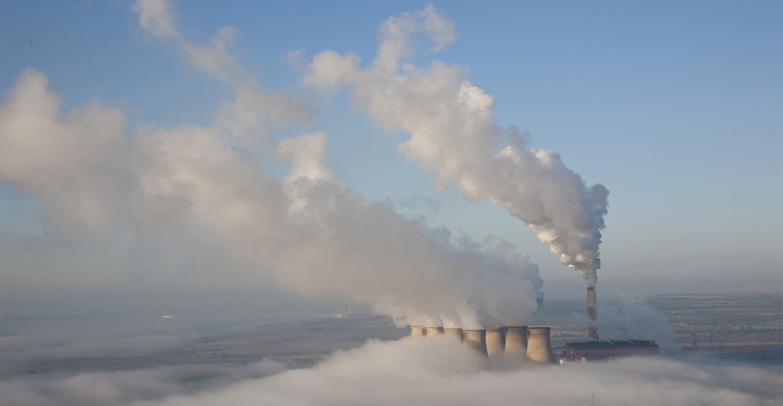Aerial image of a power station on a misty morning