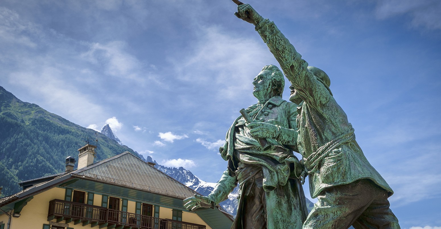 Statue of climbers Horace-Benedict de Saussure and Jacques Balmat (R) pointing at Mont Banc in Chamonix, French Alps, France, Europe