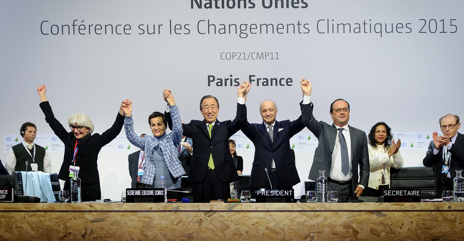 Laurence Tubiana, Christiana Figueres, Ban Ki-moon, Laurent Fabius & Francois Hollande celebrate the successful end of the COP21 Paris Climate Conference.