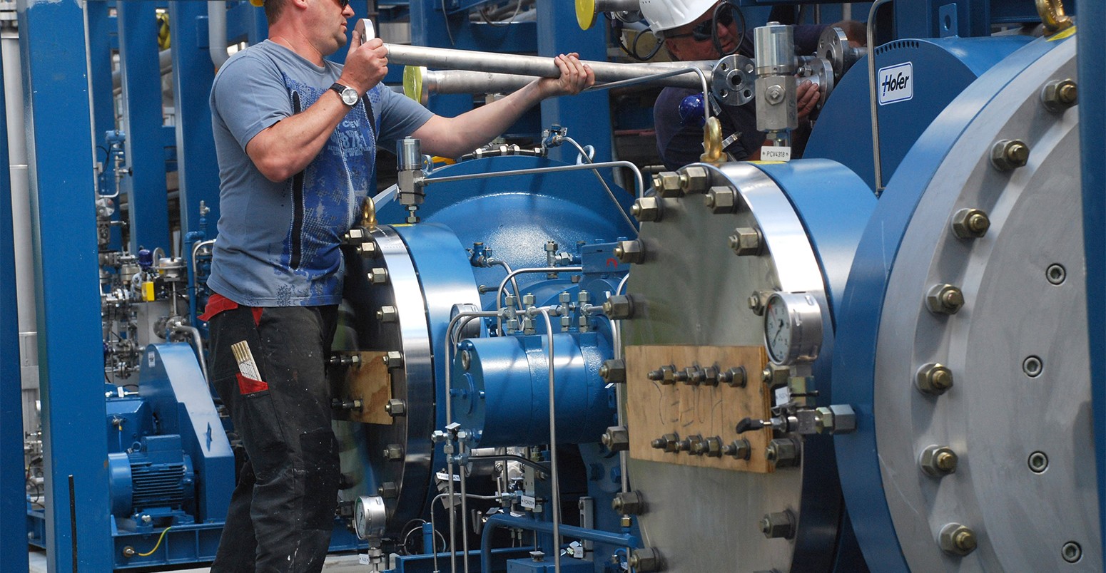 A mechanic at work installing new filters as part of a carbon capture pilot project (CCS) in Spremberg, Germany