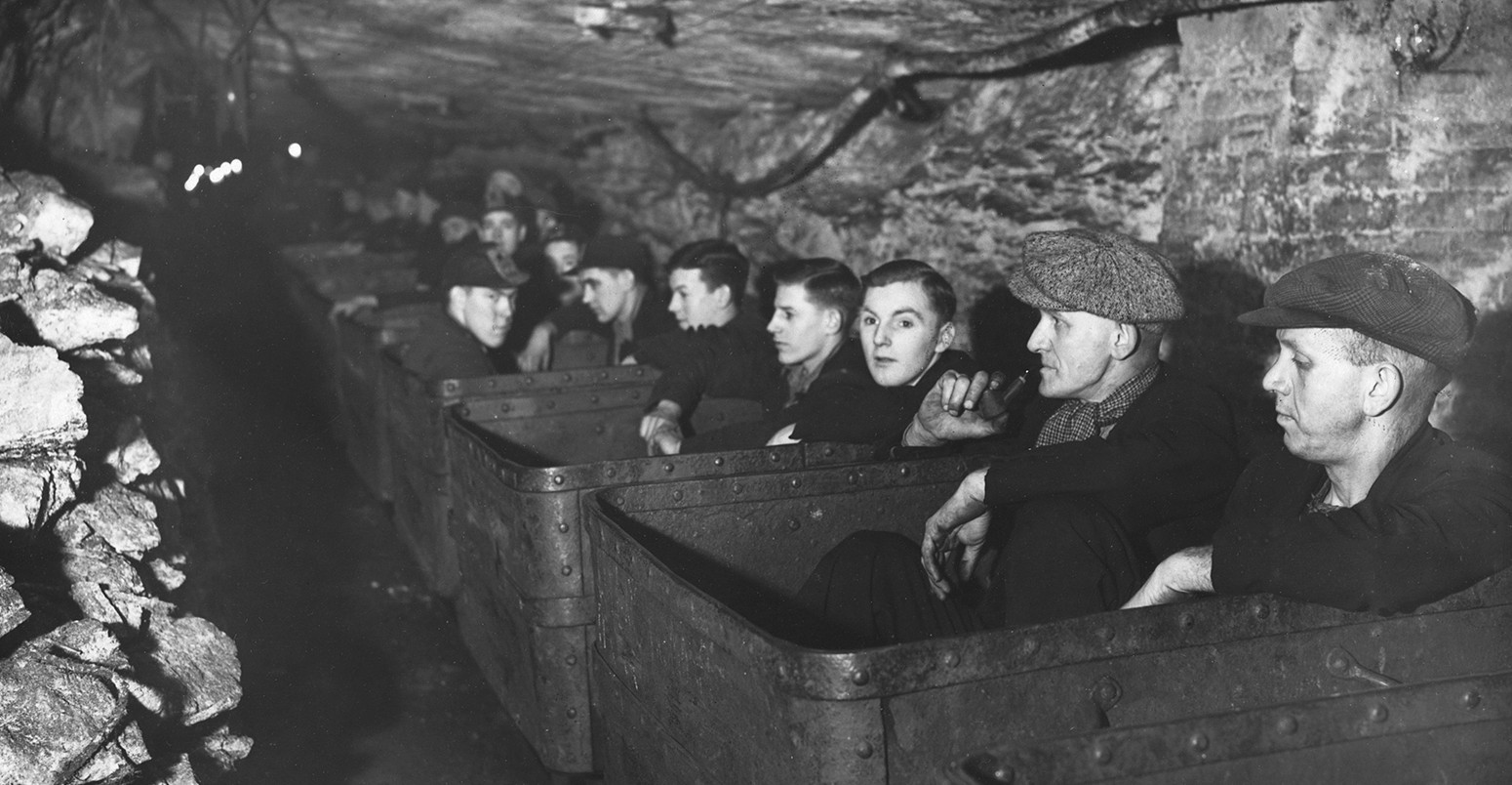 Coal Miners in Ore Cars Ready for Work in 1939