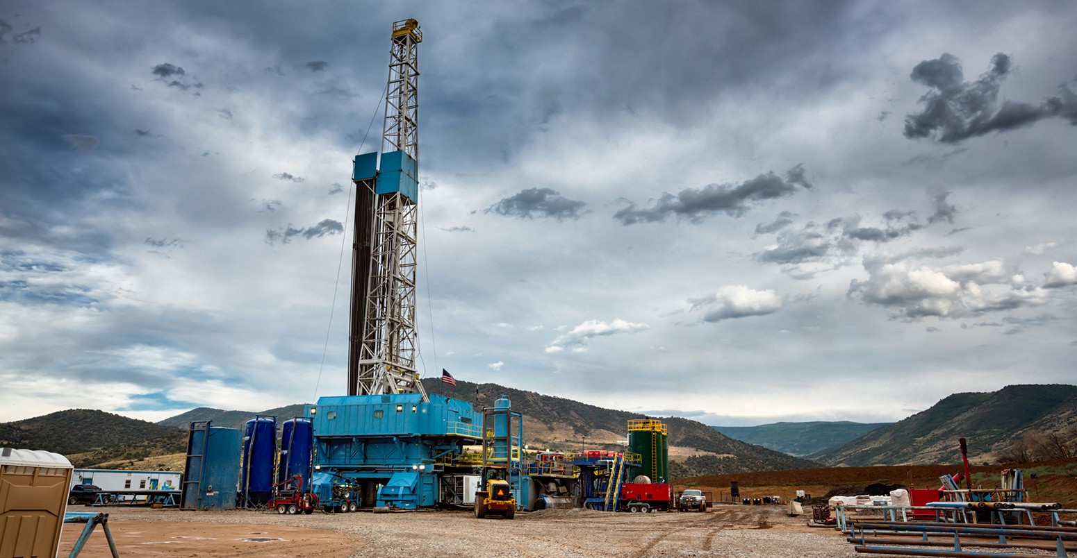 Drilling Fracking Rig overlooking a vast valley in Northern Colorado.