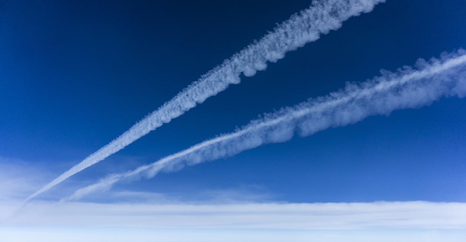 Mid-air view of et contrails in the sky