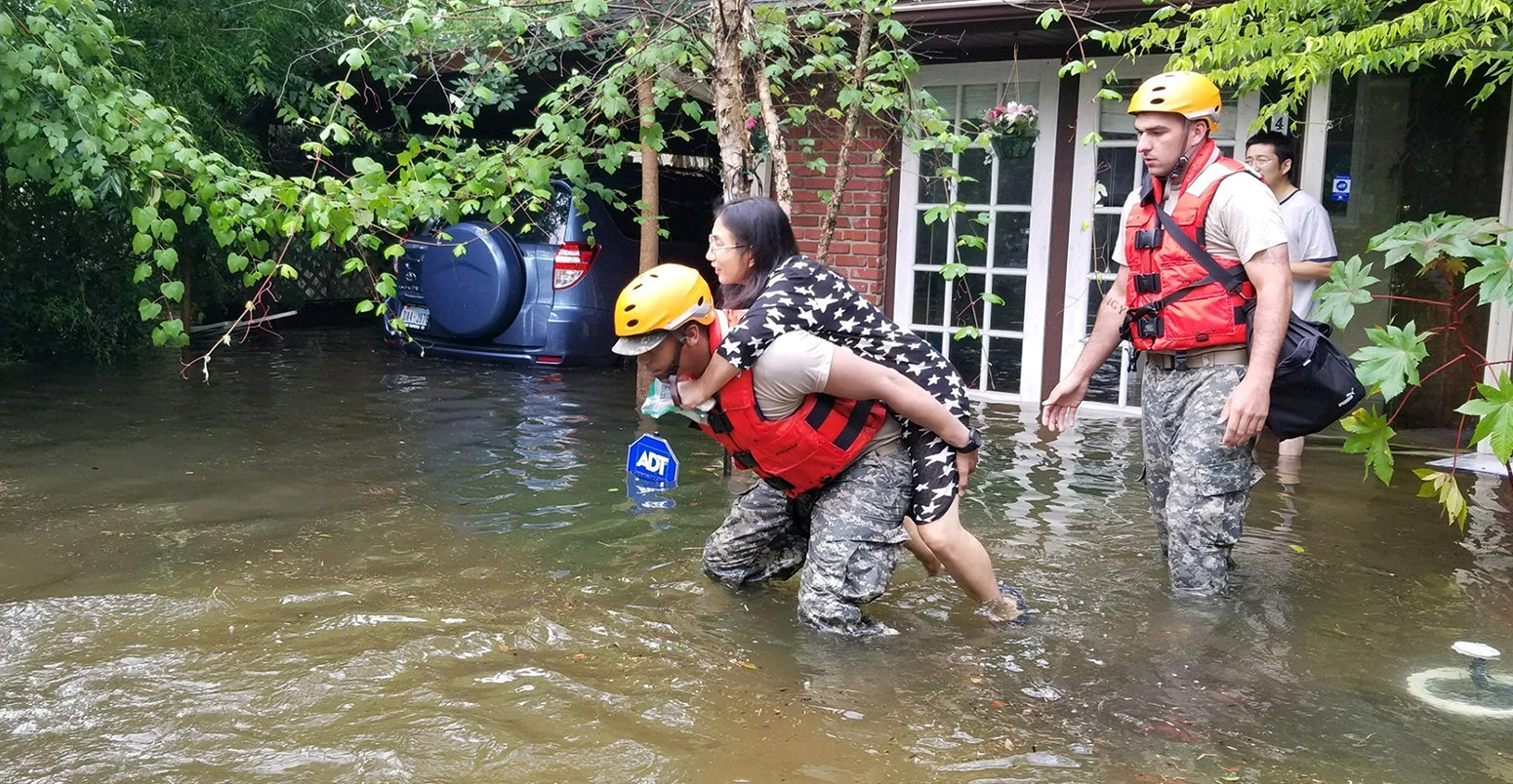 National guardsmen rescue residents stranded by flooding after Hurricane Harvey hit the Texas coast, 27/08/2017, Houston, Texas.