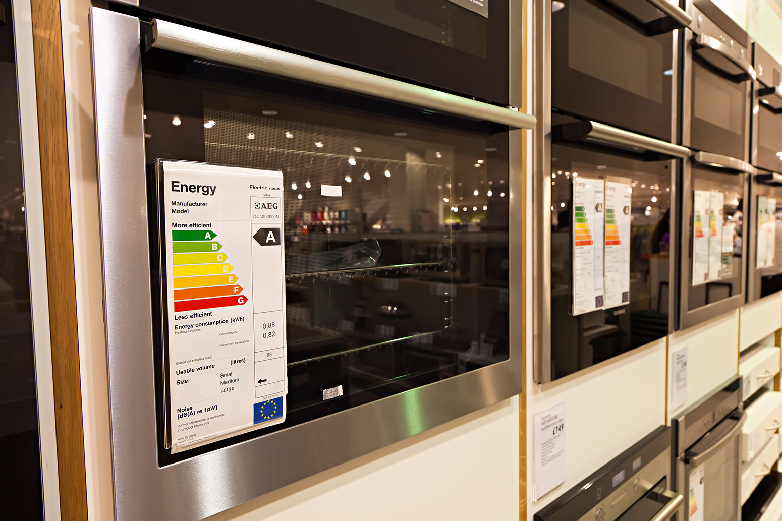 Energy efficiency rating on electric ovens in store UK.
