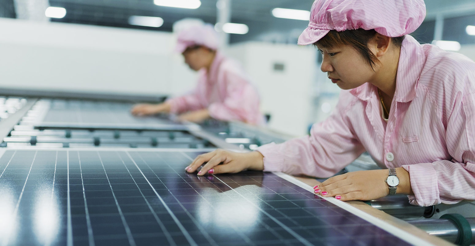 FB1CPX Female workers in solar panel assembly factory, Solar Valley, Dezhou, China