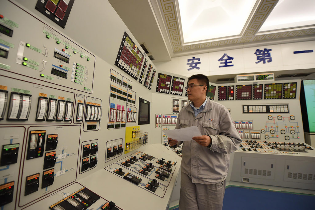 A man works at the control room of No.2 power generation unit of the Hongyanhe Nuclear Power Station in Wafangdian of Dalian City, northeast China's Liaoning Province, Sept. 22, 2016. Credit: Xinhua / Alamy Stock Photo H1ACAN