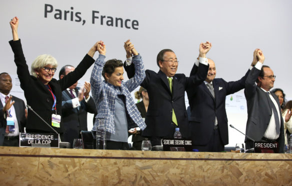 Members of COP 21 celebrate the adoption of the Paris Agreement, 12 December 2015. Credit: IISD/ENB | Kiara Worth