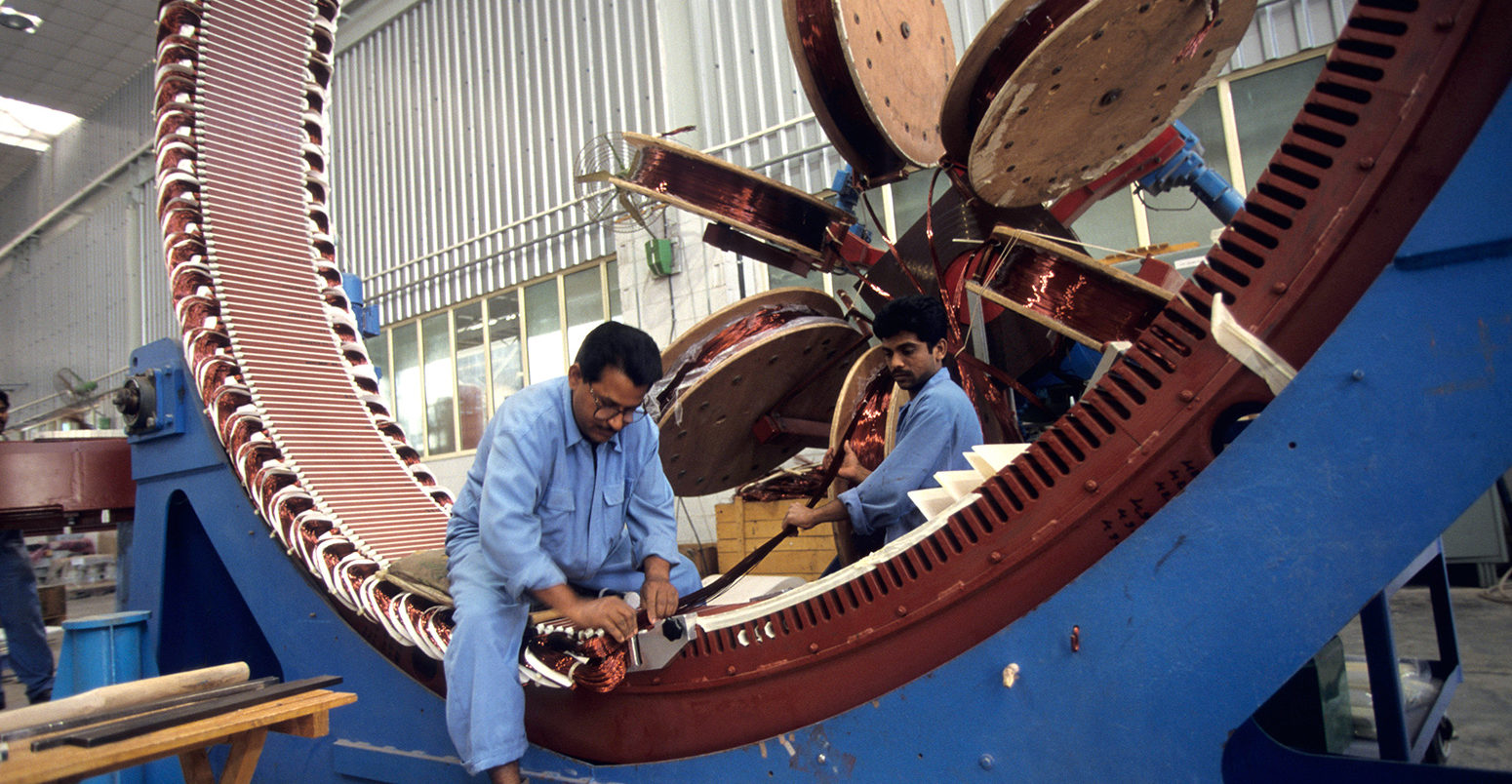 Production of a wind turbine generator at Daman Enercon India Ltd. Credit: Joerg Boethling / Alamy Stock Photo. C5WWNX