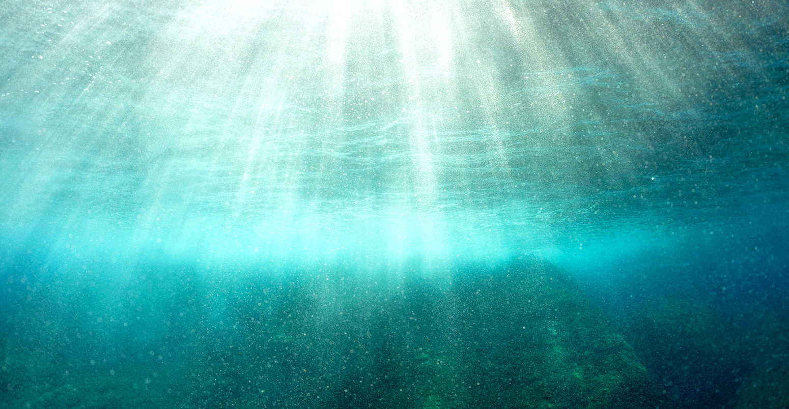 Sunrays penetrating water's surface, Port-Cros island, France. Credit: Sami Sarkis / Alamy Stock Photo.CE9ENH