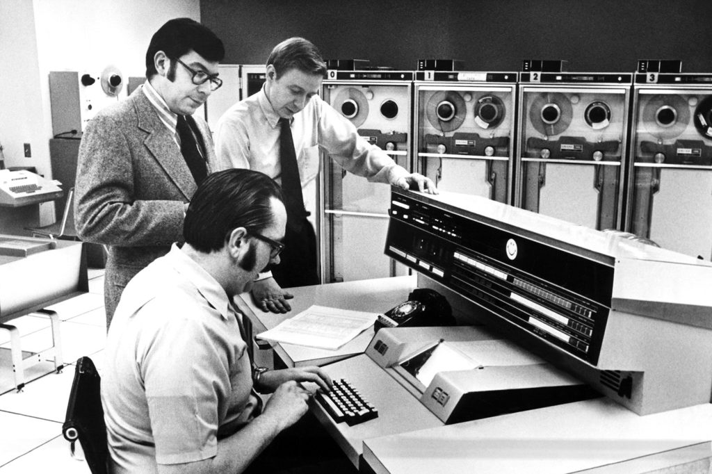 Officials at the main console of Univac 1108, 1972. Credit: Everett Collection Historical / Alamy Stock Photo. CWA69N