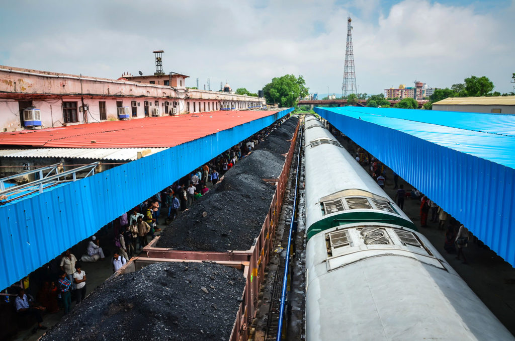 A coal train passes through a station in Jaipur, India. Credit: Sandra Foyt / Alamy Stock Photo. M4W32A