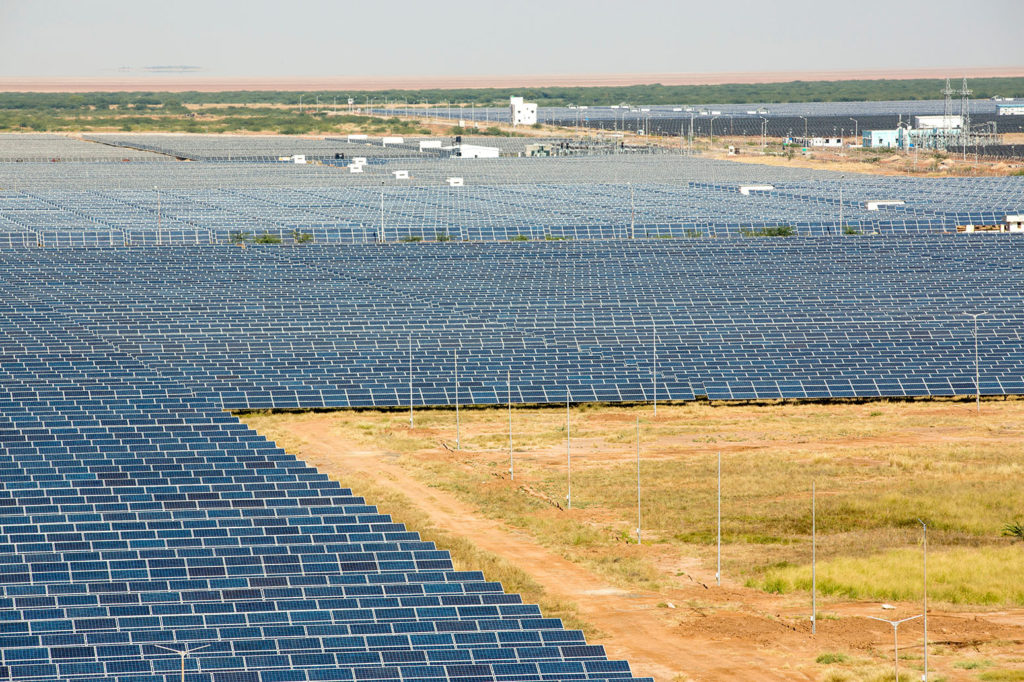 Gujarat Solar Park, in Gujarat, India, in 2013. It now has an installed capacity of 1637 MW. Credit: Ashley Cooper / Alamy Stock Photo. DRMTM7
