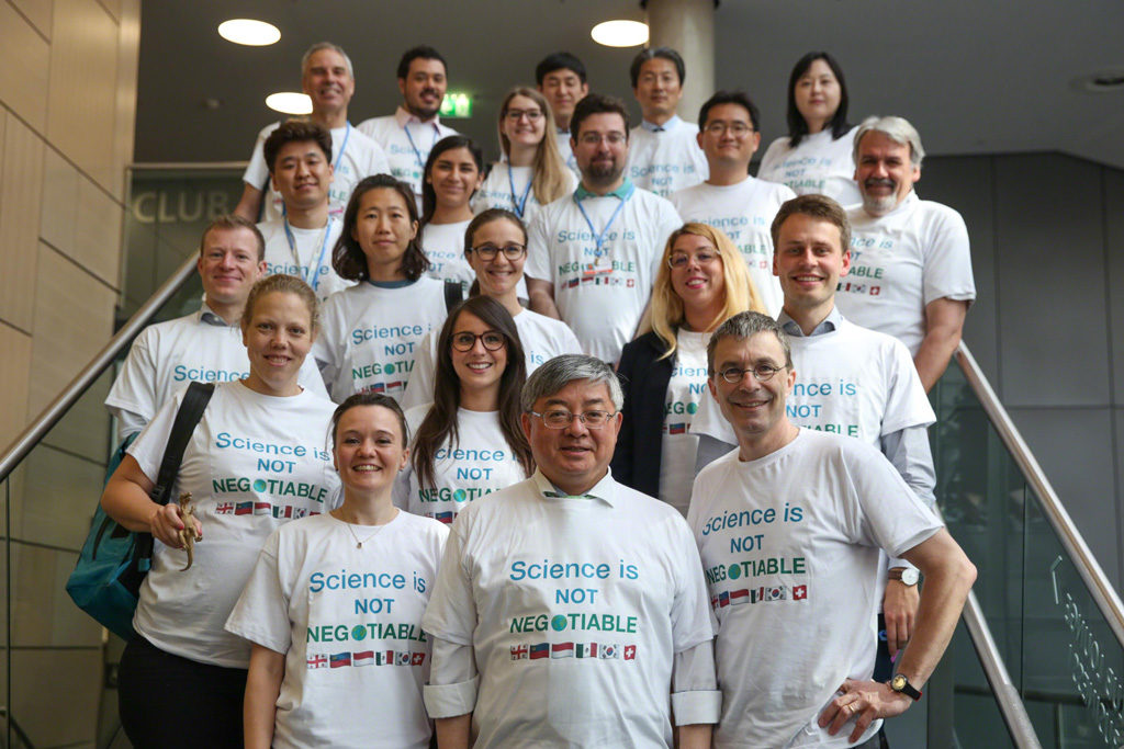 Members of the Environmental Integrity Group arrived at the closing plenary in T-shirts saying “science is not negotiable”. Photo by <a target=