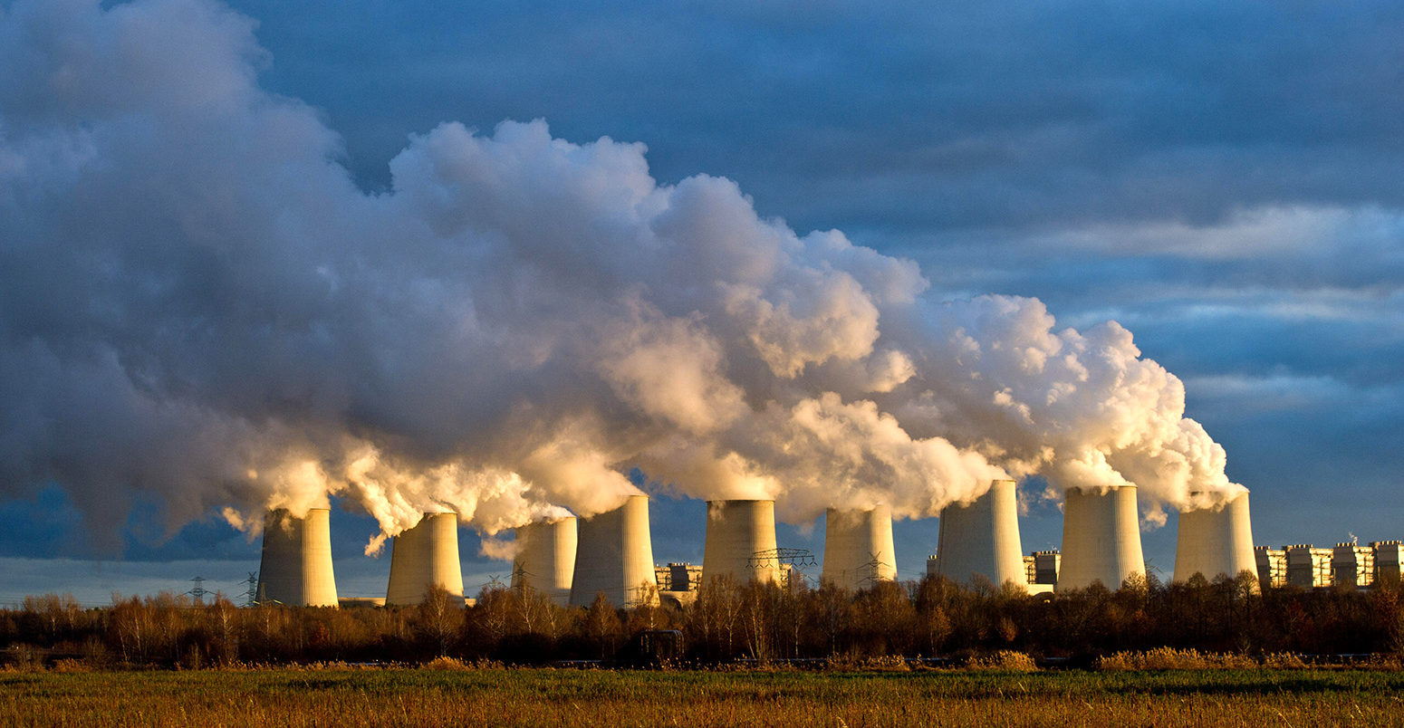 Cooling towers of a brown coal power station in Jänschwalde, Germany. Credit: dpa picture alliance archive / Alamy Stock Photo.