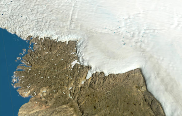 Ice sheet over northwest Greenland, 17 February 2019. Credit: LWM/NASA/LANDSAT / Alamy Stock Photo.