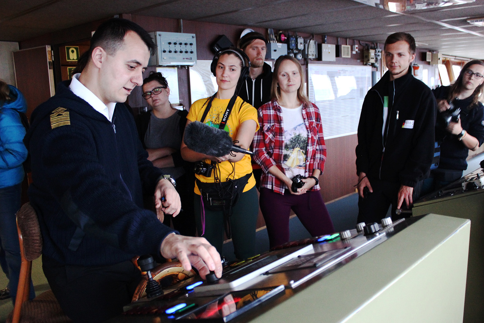Grigory Romanav, chief officer onboard the Akademik Fedorov, demonstrates equipment on the bridge of the ship.
