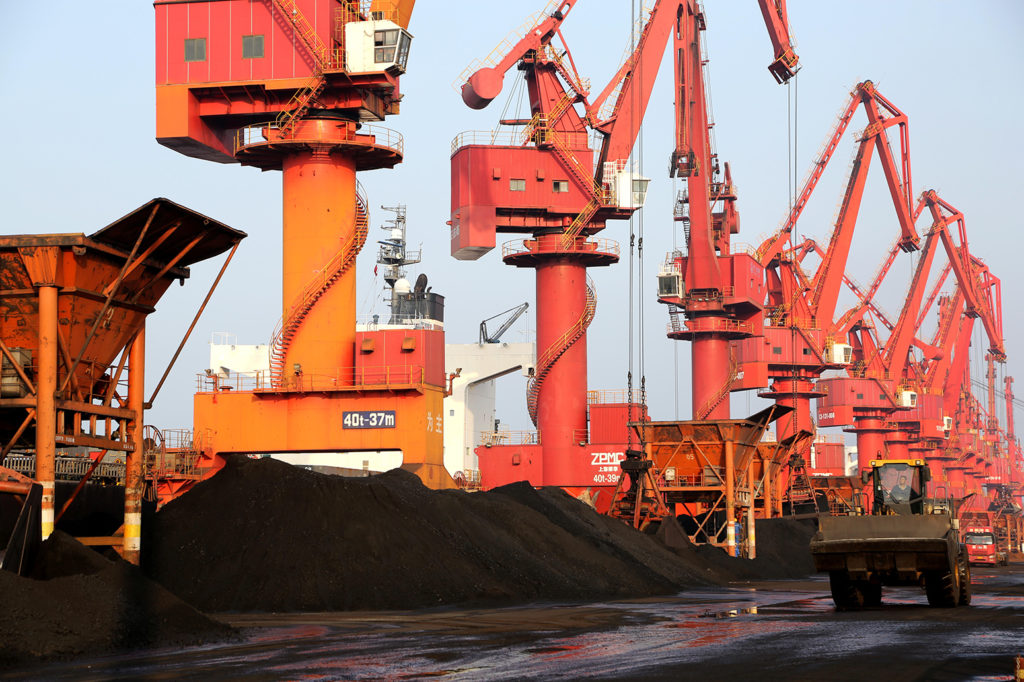 Cranes load ships with coal to be used for generating electricity at Lianyungang Port, Jiangsu Province, China. Credit: Cynthia Lee / Alamy Stock Photo. 2A60GJP