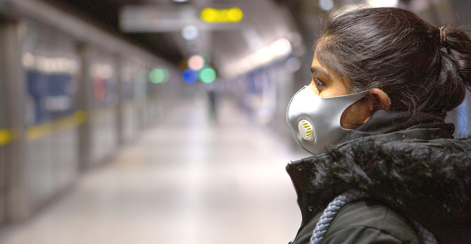 Commuters wearing face masks on the London Underground travelling during the COVID-19 outbreak, March 2020. Credit: Transport for London / Alamy Stock Photo. 2BB5C5Y