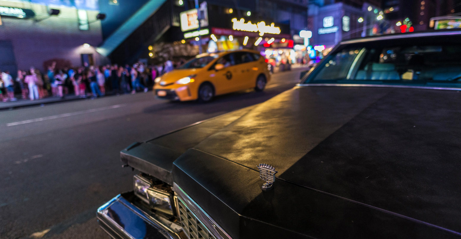 Classic American car parked at night on Seventh Avenue , New York City, USA. 30 July 2018. Credit: Jordi De Rueda Roigé / Alamy Stock Photo