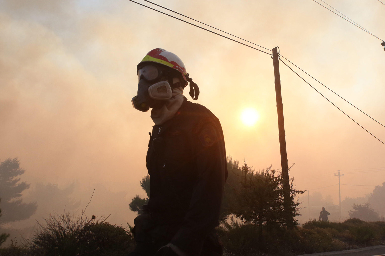A firefighter is pictured during a forest fire at Varnava village, Kalamos, Greece (Aug. 14, 2017).