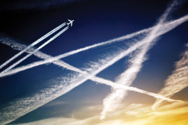 Aeroplane and aircraft jet trails in the sky.