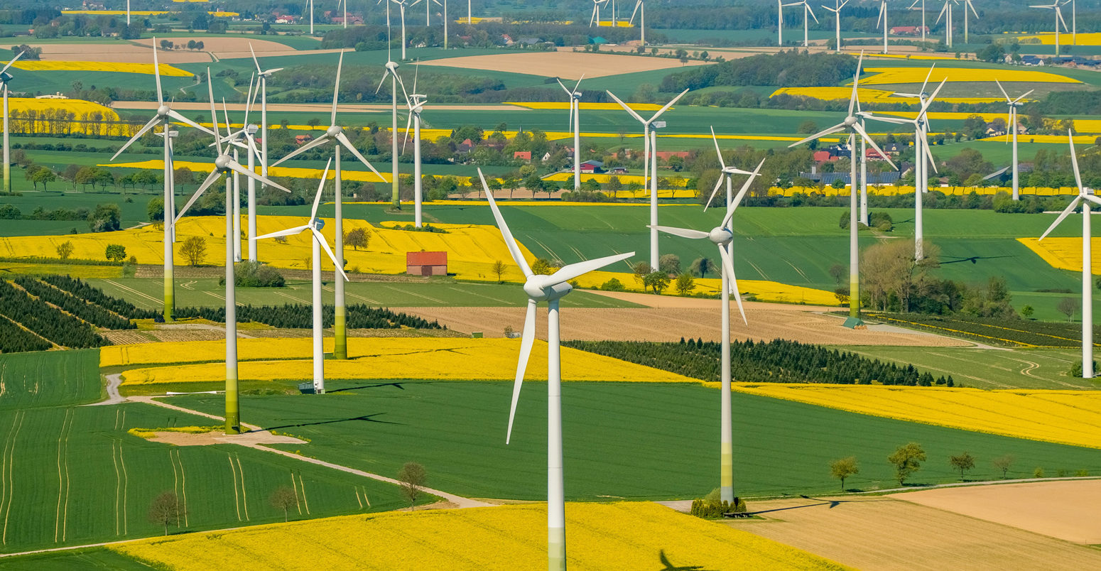 Wind-farm-and-rapeseed-fields-on-the-town-borders-between-Warstein-Belecke-and-Anrochte-Erwitte,-Germany
