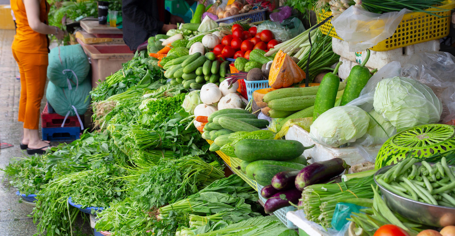 stall with fresh green vegetables on farmers market