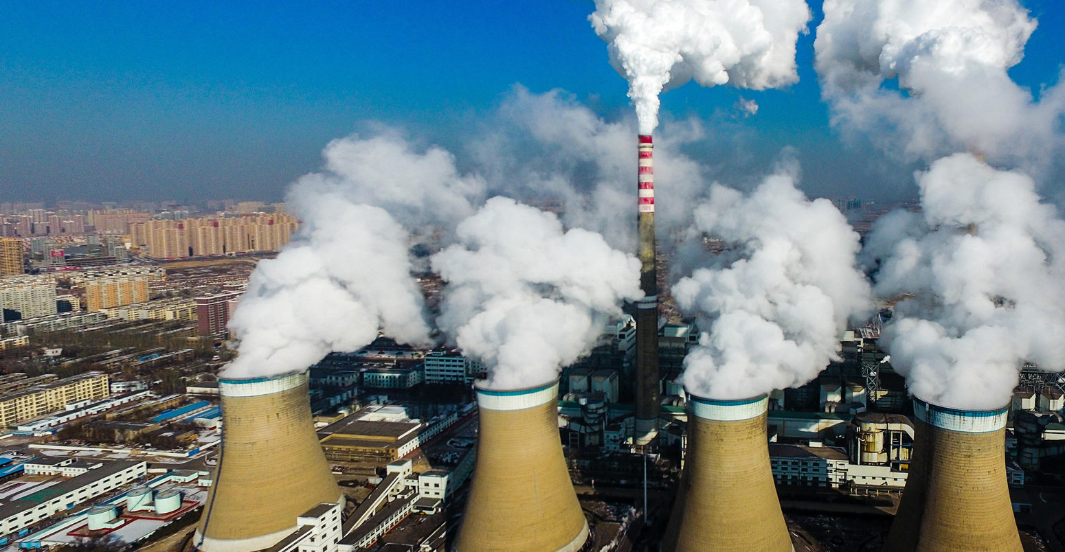 Smoke is discharged from chimneys at a coal-fired power plant in Datong city, Shanxi province