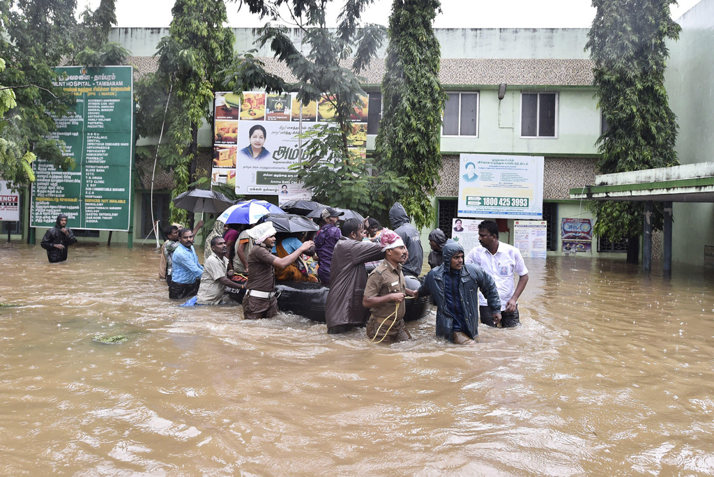 Rescuers evacuate people to safe places in Chennai, India