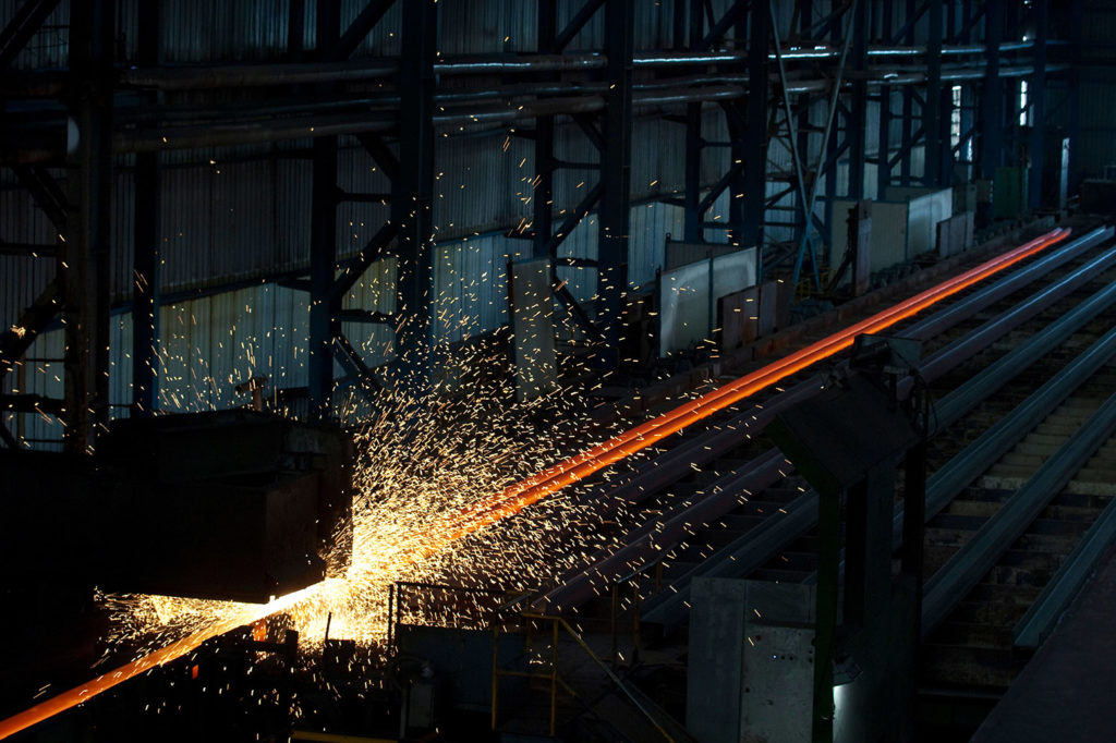 A machine forging steel poles, Laiwu, Shandong, China. Credit: TAO Images Limited / Alamy Stock Photo.