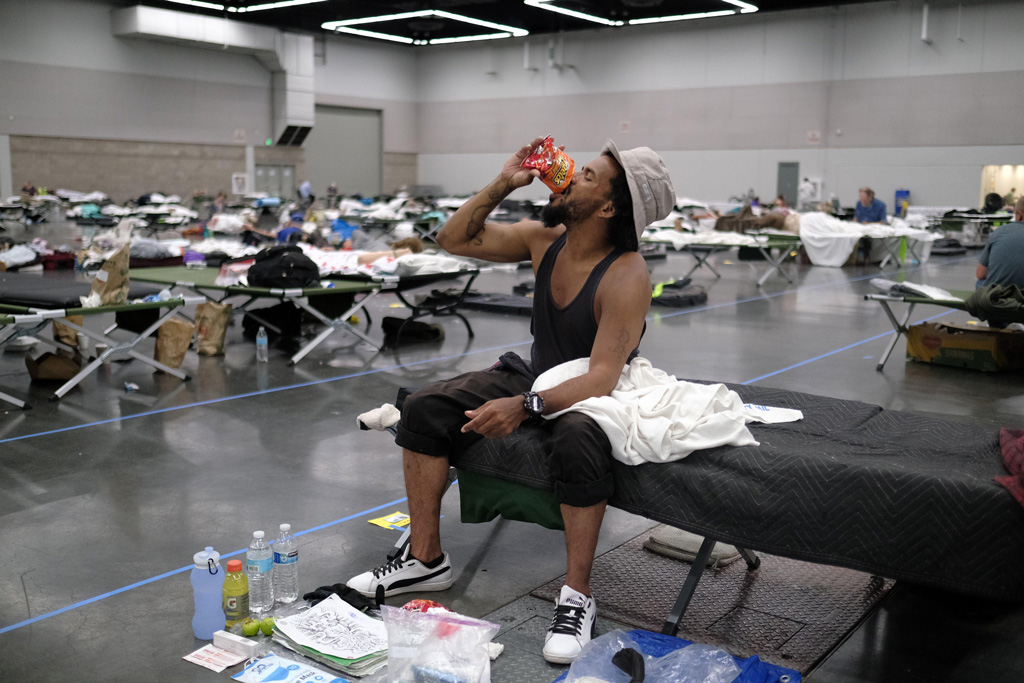 Man cools off at a cooling shelter in Portland, Oregan
