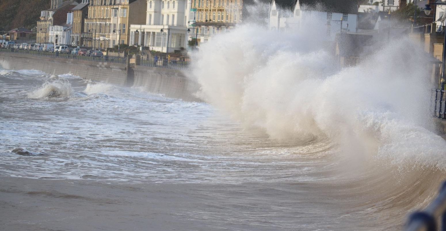 Waves crashing into sea wall, Filey Bay, Yorkshire