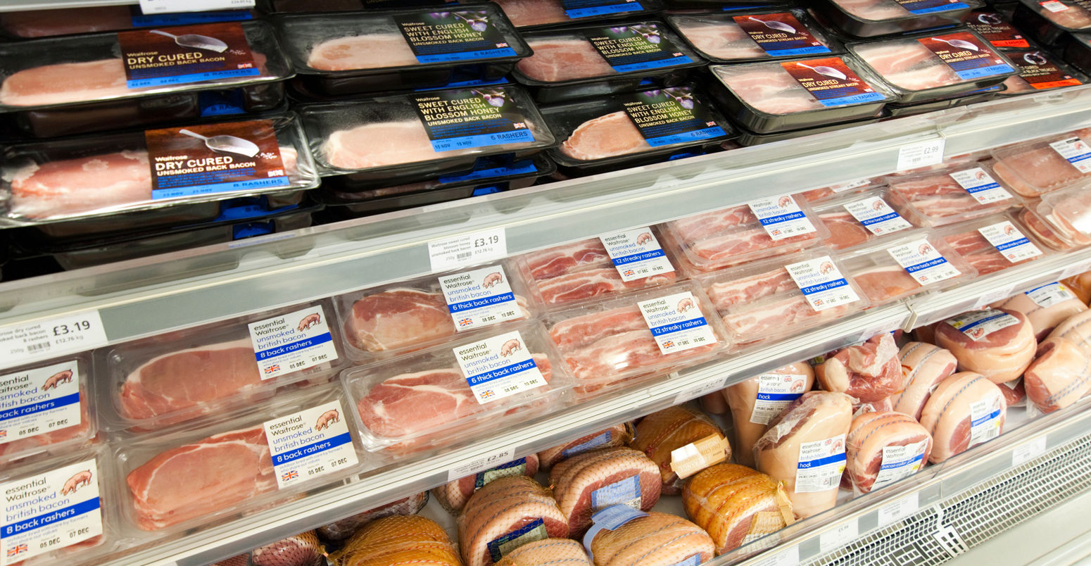 Bacon and pork on shelves in a UK supermarket