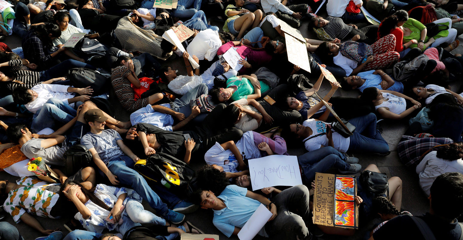People stage a die-in during a Fridays for Future march in New Delhi