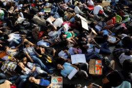 People stage a die-in during a Fridays for Future march in New Delhi