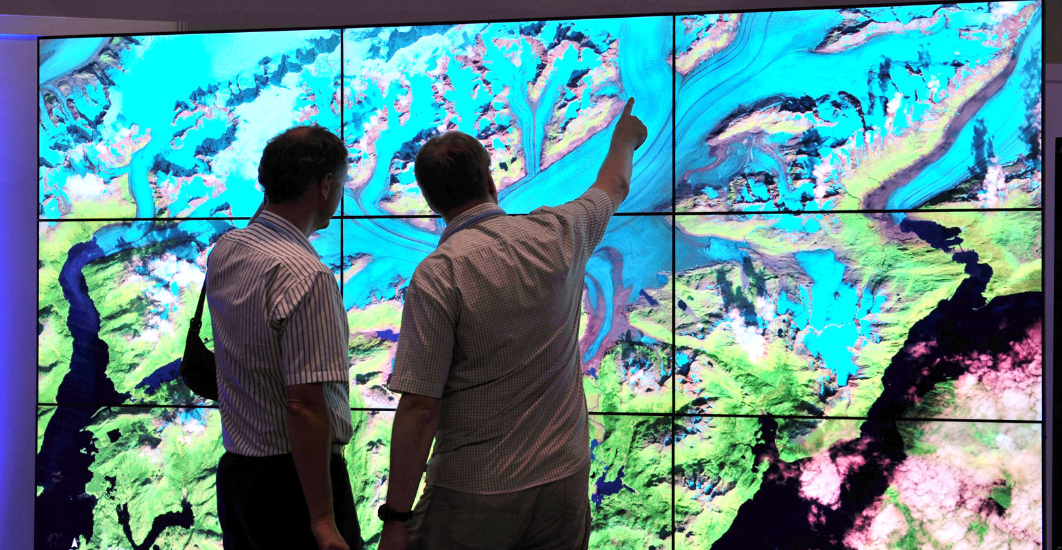 European space scientists view NASA data visualizations at the US Center during COP 18 Doha