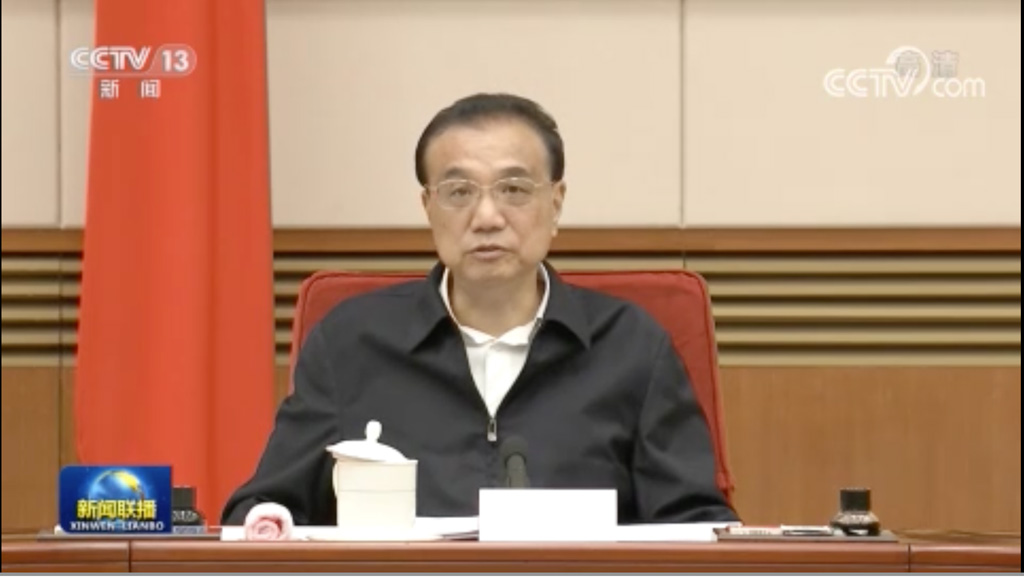 Screenshot of a CCTV news clip showing Premier Li Keqiang speaking during a meeting of the National Energy Committee in Beijing
