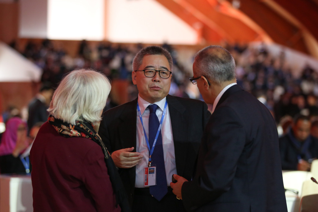 Su Wei speaks with Laurence Tubiana and Ahmed Djoghlaf at COP21
